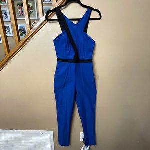 Material girl royal blur jumpsuit. Size M, spandex, features peekaboo keyhole.
